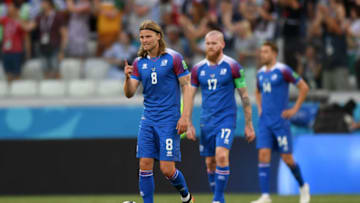 VOLGOGRAD, RUSSIA - JUNE 22: Birkir Bjarnason, Aron Gunnarsson, Kari Arnason of Iceland stand dejected during the 2018 FIFA World Cup Russia group D match between Nigeria and Iceland at Volgograd Arena on June 22, 2018 in Volgograd, Russia. (Photo by Shaun Botterill/Getty Images)