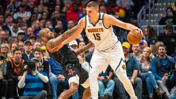 DENVER, CO - JANUARY 26: Nikola Jokic #15 of the Denver Nuggets tries to drive to the basket past P.J. Tucker #17 of the Houston Rockets at Pepsi Center on January 26, 2020 in Denver, Colorado. NOTE TO USER: User expressly acknowledges and agrees that, by downloading and/or using this photograph, user is consenting to the terms and conditions of the Getty Images License Agreement. (Photo by Timothy Nwachukwu/Getty Images)