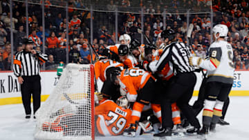 PHILADELPHIA, PENNSYLVANIA - MARCH 08: Philadelphia Flyers and Vegas Golden Knights players challenge for the puck during the first period at Wells Fargo Center on March 08, 2022 in Philadelphia, Pennsylvania. (Photo by Tim Nwachukwu/Getty Images)
