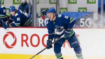 Jake Virtanen #18 of the Vancouver Canucks skates with the puck during NHL hockey action against the Toronto Maple Leafs at Rogers Arena on March 4, 2021 in Vancouver, Canada. (Photo by Rich Lam/Getty Images)