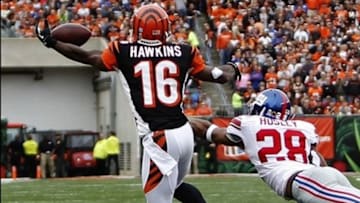 Nov 11, 2012; Cincinnati, OH, USA; Cincinnati Bengals wide receiver Andrew Hawkins (16) catches a pass for a against the New York Giants cornerback Jayron Hosley (28) during the first half at Paul Brown Stadium. Mandatory Credit: Frank Victores-USA TODAY Sports