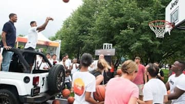 Paul George and Jalen Rose play a game of H-O-R-S-E from the Navy Pier in Chicago. (Credit:Berk Communications)