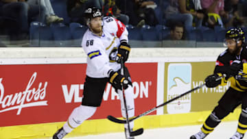 KREFELD, GERMANY - AUGUST 18: Jani Hakanpaa of Oulu Karpat shots the puck during the Champions Hockey League match between Krefeld Pinguine and Karpat Oulu at Konig Palast on August 18, 2016 in Krefeld, Germany. (Photo by Krefeld Pinguine/Champions Hockey League via Getty Images)