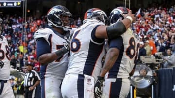 Dec 22, 2013; Houston, TX, USA; Denver Broncos tight end Julius Thomas (80) is congratulated by teammates after scoring a touchdown during the fourth quarter against the Houston Texans at Reliant Stadium. Mandatory Credit: Troy Taormina-USA TODAY Sports