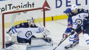 NEW YORK, NY - MARCH 06: Winnipeg Jets goaltender Steve Mason (35) prepares to make save on shot by New York Rangers center David Desharnais (51) as Winnipeg Jets right wing Blake Wheeler (26) defends during the Winnipeg Jets and New York Rangers NHL game on March 6, 2018, at Madison Square Garden in New York, NY. (Photo by John Crouch/Icon Sportswire via Getty Images)