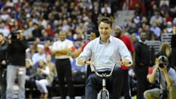 Jan 13, 2015; Washington, DC, USA; NASCAR driver Jeff Gordon takes part in an in game tricycle race during the first half of the game between the Washington Wizards and the San Antonio Spurs at Verizon Center. Mandatory Credit: Brad Mills-USA TODAY Sports