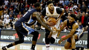 Dec 5, 2016; New Orleans, LA, USA; New Orleans Pelicans forward Anthony Davis (23) drives past Memphis Grizzlies forward JaMychal Green (0) and guard Andrew Harrison (5) during a second overtime quarter in a game at the Smoothie King Center. The Grizzlies defeated the Pelicans 110-108 in double overtime. Mandatory Credit: Derick E. Hingle-USA TODAY Sports