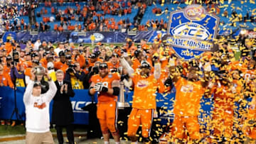 Dec 5, 2015; Charlotte, NC, USA; Clemson Tigers head coach Dabo Swinney (L) holds up the trophy for fans after winning the ACC football championship game at Bank of America Stadium. The Tigers won 45-37. Mandatory Credit: Jim Dedmon-USA TODAY Sports