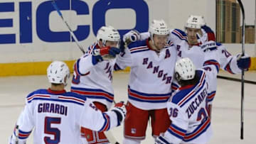 Feb 14, 2016; New York, NY, USA; New York Rangers center Derek Stepan (21) celebrates scoring his second goal during the third period against the Philadelphia Flyers at Madison Square Garden. New York Rangers won 3-1. Mandatory Credit: Anthony Gruppuso-USA TODAY Sports