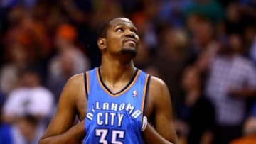 Apr 6, 2014; Phoenix, AZ, USA; Oklahoma City Thunder forward Kevin Durant reacts in the closing seconds of the game against the Phoenix Suns at US Airways Center. The Suns defeated the Thunder 122-115. Mandatory Credit: Mark J. Rebilas-USA TODAY Sports