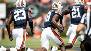 Auburn football defensive back Nehemiah Pritchett (18) scoops up a blocked field goal and returns it for a touchdown at Jordan-Hare Stadium in Auburn, Ala., on Saturday, Sept. 11, 2021. Auburn Tigers leads Alabama State Hornets 20-0 at halftime.