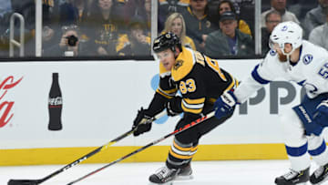 BOSTON, MA - OCTOBER 17: Karson Kuhlman #83 of the Boston Bruins skates against Braydon Coburn #55 of the Tampa Bay Lightning at the TD Garden on October 17, 2019 in Boston, Massachusetts. (Photo by Steve Babineau/NHLI via Getty Images)