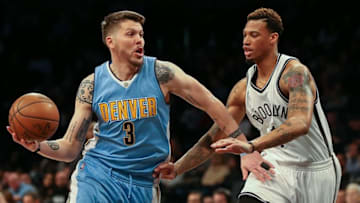 Feb 8, 2016; Brooklyn, NY, USA; Denver Nuggets guard Mike Miller (3) dribbles the ball in front of Brooklyn Nets forward Chris McCullough (1) during the first half at Barclays Center. Mandatory Credit: Vincent Carchietta-USA TODAY Sports