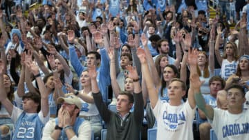 April 4, 2022; Chapel Hill, NC, USA; UNC Chapel Hill fans cheer and raise their hands during the first half at the National Championship watch party in the Dean E. Smith Center. The eight seeded Tarheels shoot a free throw against the top-seeded Kansas Jayhawks in the NCAA Tournament Championship Game. Luke Johnson Ð USA Today Sports