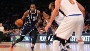 Jan 26, 2016; New York, NY, USA; Oklahoma City Thunder small forward Kevin Durant (35) drives against New York Knicks power forward Derrick Williams (23) and center Robin Lopez (8) during the first quarter at Madison Square Garden. Mandatory Credit: Brad Penner-USA TODAY Sports