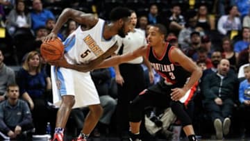Nov 9, 2015; Denver, CO, USA; Portland Trail Blazers guard C.J. McCollum (3) guards Denver Nuggets guard Will Barton (5) in the fourth quarter at the Pepsi Center. The Nuggets defeated the Trail Blazers 108-104. Mandatory Credit: Isaiah J. Downing-USA TODAY Sports