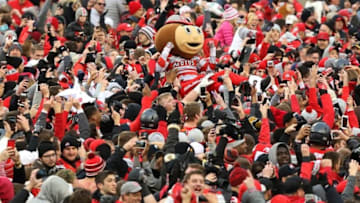 Nov 26, 2016; Columbus, OH, USA; Brutus Buckeye crowd surfs as fans surge onto the field following the win over the Michigan Wolverines at Ohio Stadium. Ohio State won 30-27. Mandatory Credit: Joe Maiorana-USA TODAY Sports