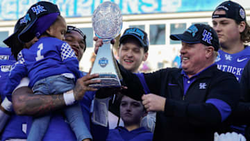 Kentucky Wildcats head coach Mark Stoops and MVP quarterback Lynn Bowden Jr. Credit: Jim Dedmon-USA TODAY Sports