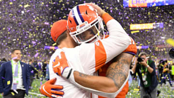 NEW ORLEANS, LA - JANUARY 13: Head coach Dabo Swinney of the Clemson Tigers embraces Isaiah Simmons #11 during the College Football Playoff National Championship held at the Mercedes-Benz Superdome on January 13, 2020 in New Orleans, Louisiana. (Photo by Justin Tafoya/Getty Images)