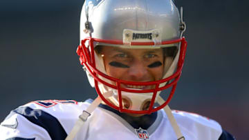DENVER, CO - DECEMBER 18: Quarterback Tom Brady #12 of the New England Patriots looks on as he warms up before a game against the Denver Broncos at Sports Authority Field at Mile High on December 18, 2016 in Denver, Colorado. (Photo by Justin Edmonds/Getty Images)