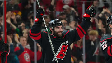 Jan 29, 2023; Raleigh, North Carolina, USA; Carolina Hurricanes left wing Jordan Martinook (48) celebrates their victory against the Boston Bruins at PNC Arena. Mandatory Credit: James Guillory-USA TODAY Sports