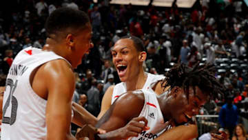 ATLANTA, GA - MARCH 28: Nassir Little #10 of Orlando Christian Prep is congratulated by teammates Keldon Johnson #23 of Oak Hill Academy and Darius Bazley #15 of Princeton High School after he won the MVP trophy in the 2018 McDonald's All American Game at Philips Arena on March 28, 2018 in Atlanta, Georgia. (Photo by Kevin C. Cox/Getty Images)