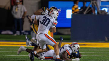 Auburn footballSep 9, 2023; Berkeley, California, USA; California Golden Bears running back Isaiah Ifanse (22) fumbles the football recovered by Auburn Tigers linebacker Jalen McLeod (35) during the second quarter at California Memorial Stadium. Mandatory Credit: Neville E. Guard-USA TODAY Sports