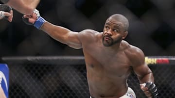 Oct 3, 2015; Houston, TX, USA; Rashad Evans (blue gloves) competes against Ryan Bader (red gloves) during their Light Heavyweight bout at UFC 192 at Toyota Center. Mandatory Credit: Troy Taormina-USA TODAY Sports