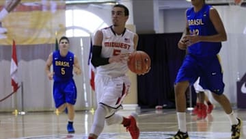 Jul 18, 2013; Washington, DC, USA; Team USA Midwest player Tyus Jones (5) dribbles the ball against Team Brasil during the Nike Global Challenge at Trinity University in Washington, DC. Mandatory Credit: Geoff Burke-USA TODAY Sports