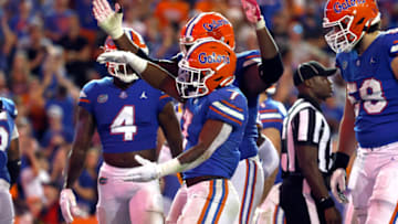 Oct 15, 2022; Gainesville, Florida, USA; Florida Gators running back Trevor Etienne (7) scores a touchdown against the LSU Tigers during the second half at Ben Hill Griffin Stadium. Mandatory Credit: Kim Klement-USA TODAY Sports