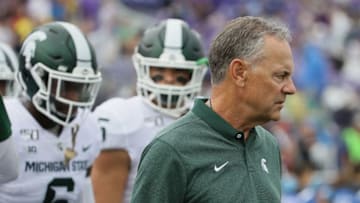 EVANSTON, ILLINOIS - SEPTEMBER 21: Head coach Mark Dantonio of the Michigan State Spartans leads his team on to the field before a game against the Northwestern Wildcats at Ryan Field on September 21, 2019 in Evanston, Illinois. (Photo by Jonathan Daniel/Getty Images)