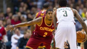 Nov 3, 2012; Milwaukee, WI, USA; Cleveland Cavaliers guard Kyrie Irving (2) defends Milwaukee Bucks guard Brandon Jennings (3) during the game at the BMO Harris Bradley Center. The Bucks defeated the Cavaliers 105-102. Mandatory Credit: Jeff Hanisch-USA TODAY Sports