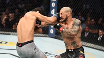 TAMPA, FLORIDA - OCTOBER 12: (R-L) Cub Swanson and Kron Gracie of Brazil exchaneg punches in their featherweight bout during the UFC Fight Night event at Amalie Arena on October 12, 2019 in Tampa, Florida. (Photo by Josh Hedges/Zuffa LLC via Getty Images)