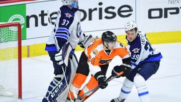 Nov 17, 2016; Philadelphia, PA, USA; Philadelphia Flyers right wing Matt Read (24) battles with Winnipeg Jets defenseman Toby Enstrom (39) in front of goalie Connor Hellebuyck (37) during the third period at Wells Fargo Center. The Flyers defeated the Jets, 5-2. Mandatory Credit: Eric Hartline-USA TODAY Sports