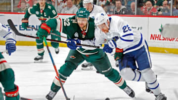 ST. PAUL, MN - DECEMBER 01: Nino Niederreiter #22 of the Minnesota Wild and Connor Brown #28 of the Toronto Maple Leafs battle for the puck during a game at Xcel Energy Center on December 1, 2018 in St. Paul, Minnesota.(Photo by Bruce Kluckhohn/NHLI via Getty Images)