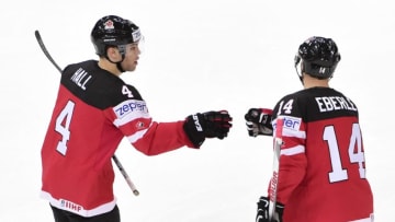 Forward Taylor Hall (L) of Canada celebrates with his teammate forward Jordan Eberle after scoring a goal during the group A preliminary round match Canada vs Austria of the 2015 IIHF Ice Hockey World Championships on May 12, 2015 at the O2 Arena in Prague. AFP PHOTO / JONATHAN NACKSTRAND (Photo credit should read JONATHAN NACKSTRAND/AFP/Getty Images)