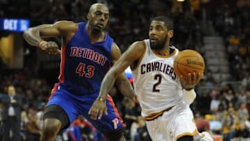 Apr 13, 2015; Cleveland, OH, USA; Cleveland Cavaliers guard Kyrie Irving (2) drives past Detroit Pistons forward Anthony Tolliver (43) during the second quarter at Quicken Loans Arena. Mandatory Credit: Ken Blaze-USA TODAY Sports