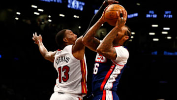 Brooklyn Nets forward James Johnson (16) goes up for a shot while being defended by Miami Heat center Bam Adebayo (13)( Andy Marlin-USA TODAY Sports)