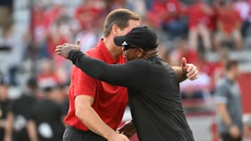 Athletic Director Trev Alberts of the Nebraska Cornhuskers greets interim head coach Mickey Joseph (Photo by Steven Branscombe/Getty Images)