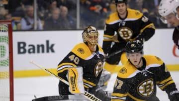 Nov 12, 2015; Boston, MA, USA; Boston Bruins defenseman Torey Krug (47) drops to block a shot in front of goalie Tuukka Rask (40) during the third period against the Colorado Avalanche at TD Garden. Mandatory Credit: Bob DeChiara-USA TODAY Sports