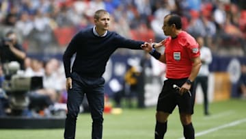 Sep 24, 2016; Vancouver, British Columbia, CAN; Vancouver Whitecaps head coach Carl Robinson speaks with referee Baldomero Toldeo during the first half of a game against the Colorado Rapids at BC Place. Vancouver tied Colorado 3-3. Mandatory Credit: Jennifer Buchanan-USA TODAY Sports