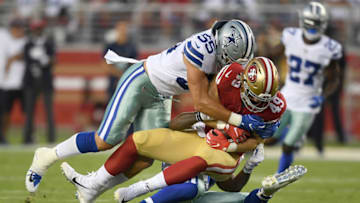SANTA CLARA, CA - AUGUST 09: Leighton Vander Esch #55 and Justin March-Lillard #53 of the Dallas Cowboys tackles Marcell Harris #49 of the San Francisco 49ers in the second quarter of their NFL preseason football game at Levi's Stadium on August 9, 2018 in Santa Clara, California. (Photo by Thearon W. Henderson/Getty Images)