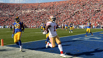 LOS ANGELES, CA - DECEMBER 31: Marquise Goodwin #11 of the San Francisco 49ers scores a touchdown during the first quarter against Brandon Allen #8 of the Los Angeles Rams at Los Angeles Memorial Coliseum on December 31, 2017 in Los Angeles, California. (Photo by Kevork Djansezian/Getty Images)