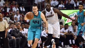 Apr 17, 2016; Miami, FL, USA; Charlotte Hornets center Frank Kaminsky III (44) chases a loose ball in front of Miami Heat forward Luol Deng (9) during the second half in game one of the first round of the NBA Playoffs at American Airlines Arena. The Heat won 123-91. Mandatory Credit: Steve Mitchell-USA TODAY Sports