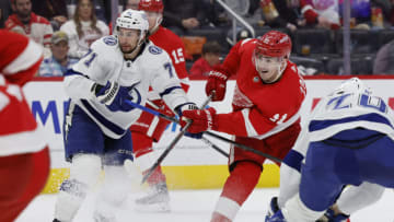 Mar 26, 2022; Detroit, Michigan, USA; Detroit Red Wings right wing Filip Zadina (11) takes a shot defended by Tampa Bay Lightning center Anthony Cirelli (71) in the second period at Little Caesars Arena. Mandatory Credit: Rick Osentoski-USA TODAY Sports