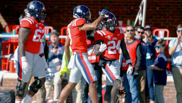 Nov 18, 2023; Oxford, Mississippi, USA; Mississippi Rebels wide receiver Tre Harris (9) reacts with running back Ulysses Bentley IV (24) after a touchdown during the first half against the Louisiana Monroe Warhawks at Vaught-Hemingway Stadium. Mandatory Credit: Petre Thomas-USA TODAY Sports