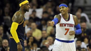 Oct 30, 2014; Cleveland, OH, USA; New York Knicks forward Carmelo Anthony (7) reacts beside Cleveland Cavaliers forward LeBron James (23) in the first quarter at Quicken Loans Arena. Mandatory Credit: David Richard-USA TODAY Sports