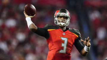 TAMPA, FL - DECEMBER 18: Quarterback Jameis Winston #3 of the Tampa Bay Buccaneers throws a touchdown pass in the fourth quarter against the Atlanta Falcons on December 18, 2017 at Raymond James Stadium in Tampa, Florida. (Photo by Julio Aguilar/Getty Images)