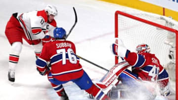 Feb 7, 2016; Montreal, Quebec, CAN; Montreal Canadiens goalie Ben Scrivens (40) makes a save against Carolina Hurricanes center Eric Staal (12) as defenseman P.K. Subban (76) defends during the first period at Bell Centre. Mandatory Credit: Jean-Yves Ahern-USA TODAY Sports