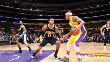 LOS ANGELES, CA - MARCH 13: Isaiah Thomas #3 of the Los Angeles Lakers handles the ball against Gary Harris #14 of the Denver Nuggets during the game between the two teams on March 13, 2018 at STAPLES Center in Los Angeles, California. NOTE TO USER: User expressly acknowledges and agrees that, by downloading and/or using this Photograph, user is consenting to the terms and conditions of the Getty Images License Agreement. Mandatory Copyright Notice: Copyright 2018 NBAE (Photo by Andrew D. Bernstein/NBAE via Getty Images)